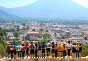 Participants in the alternative spring break trip look out onto the Guatemalan horizon. By Sandie Figueroa. 