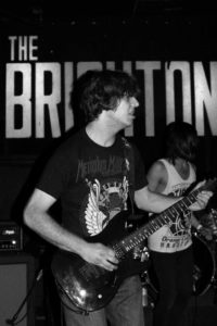 Band members jam out at the Brighton Bar. 