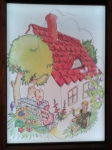 One of the more colorful artworks featured in the exhibit, depicting a family and their home.