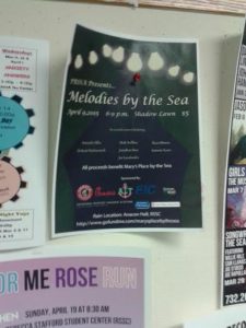 A flyer for Melodies by the Sea hangs among others in the Student Center.